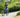 Woman riding an e-bike on a scenic path, illustrating the topic How Far Can an E-Bike Go.
